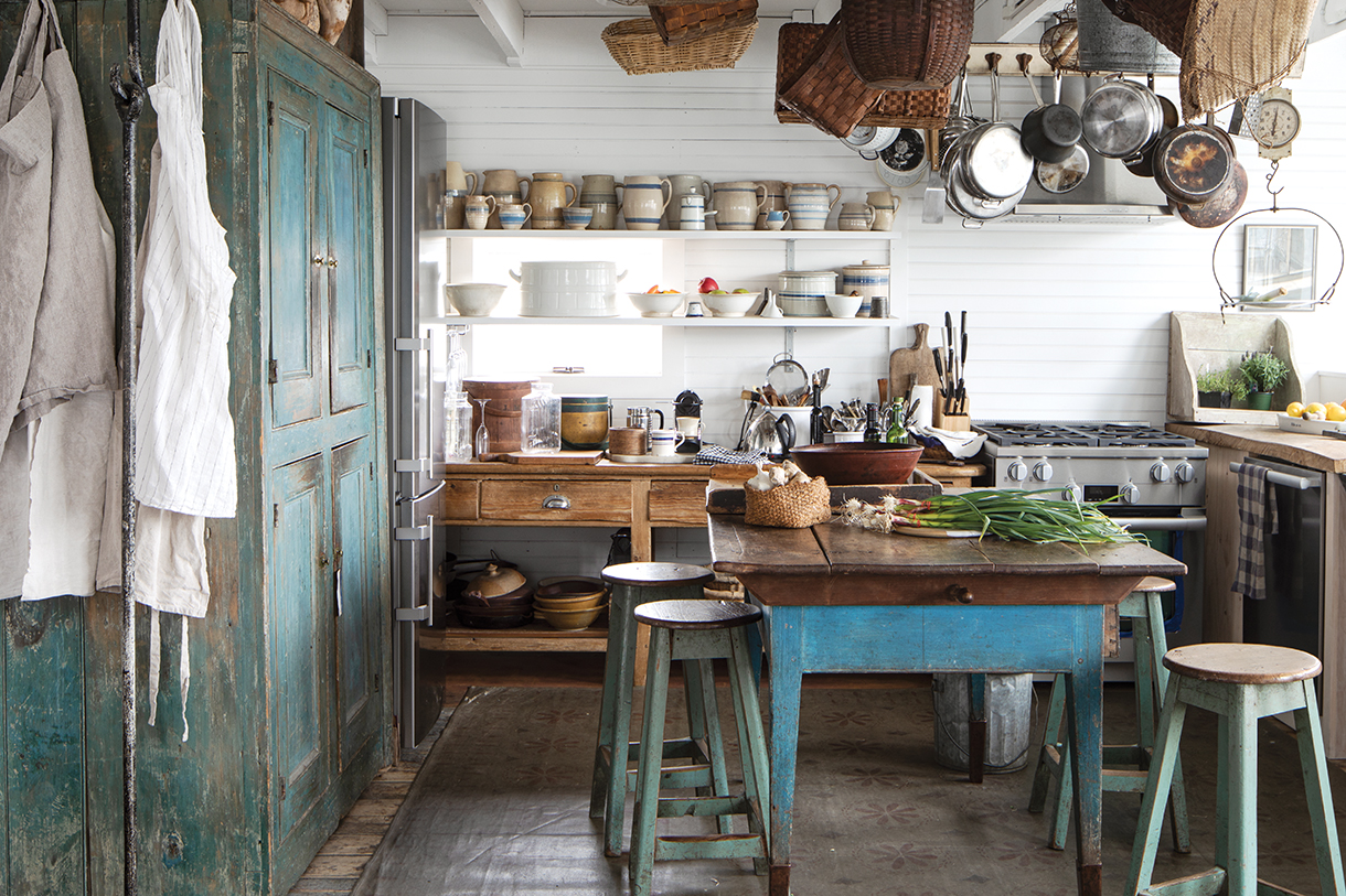 Rustic kitchen with 19th century cupboards, tables, and antiques